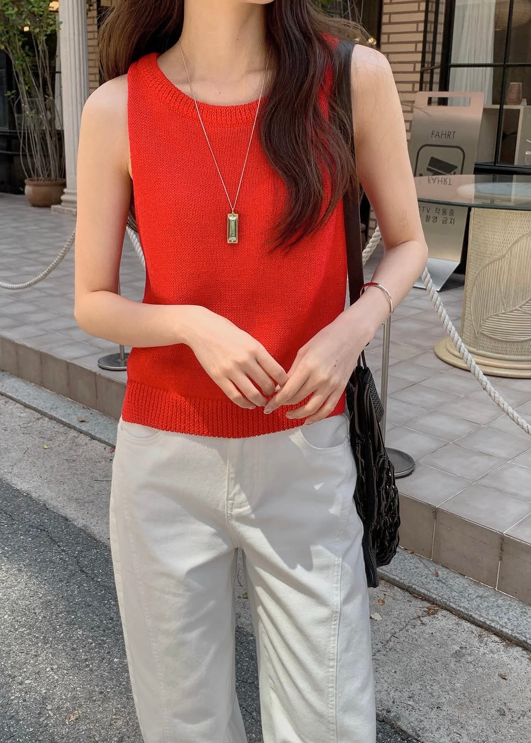 Sleeveless vented knit top